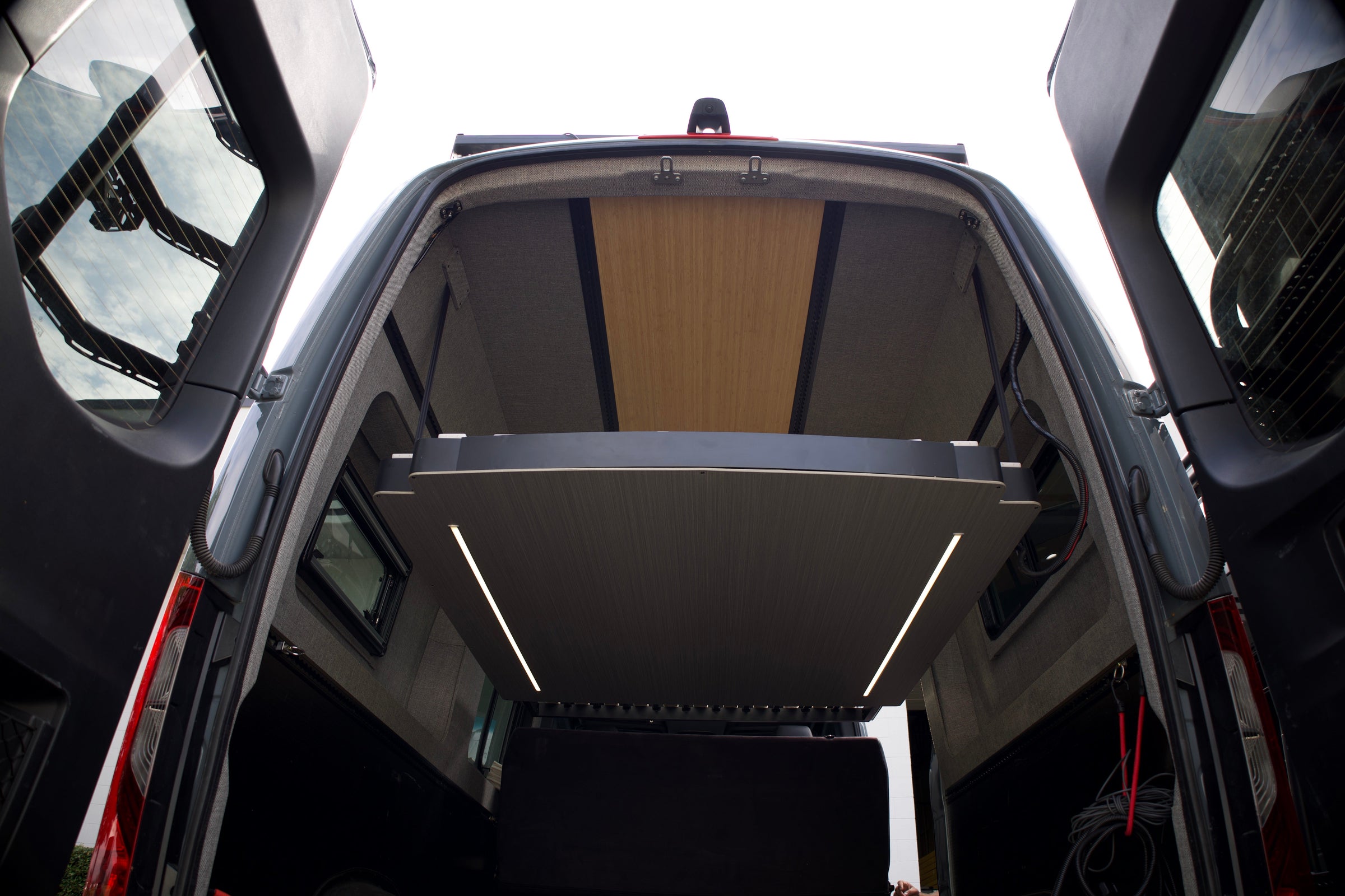RoamLabX expandable elevator bed installed in a camper van